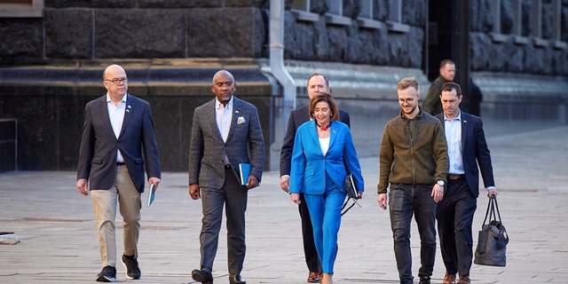 In this image released by the Ukrainian Presidential Press Office on Sunday, May 1, 2022, U.S. Speaker of the House Nancy Pelosi, center, arrives with her delegation before her meeting with Ukrainian President Volodymyr Zelenskyy, in Kyiv, Ukraine, Saturday, April 30, 2022. Pelosi, second in line to the presidency after the vice president, is the highest-ranking American leader to visit Ukraine since the start of the war, and her visit marks a major show of continuing support for the country's struggle against Russia.  