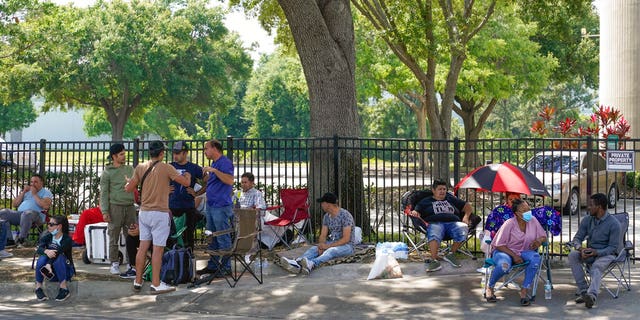 May 2, 2022: People wait outside the Orlando Immigration and Customs Enforcement facility in order to get appointments with federal immigration official in Orlando, Fla.