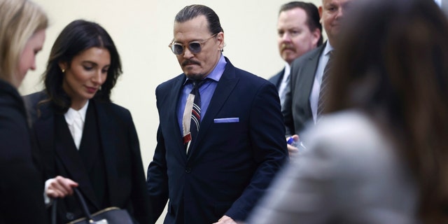 Johnny Depp enters the courtroom for his defamation trial against ex-wife Amber Heard on May 5, 2022.
