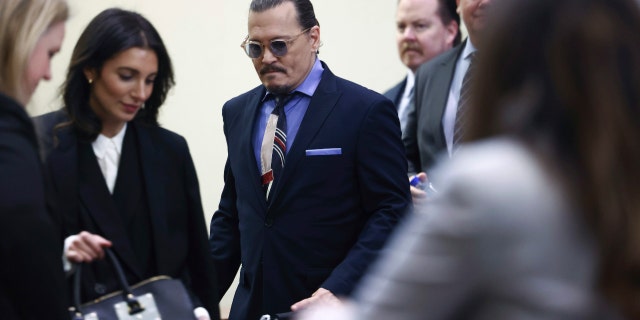 Johnny Depp enters the courtroom for his defamation trial against ex-wife Amber Heard on May 5, 2022.