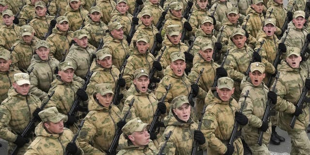 Troops march during a rehearsal for the Victory Day military parade which will take place at Dvortsovaya (Palace) Square on May 9 to celebrate 77 years after the victory in World War II in St. Petersburg, Russia, Thursday, May 5, 2022. 