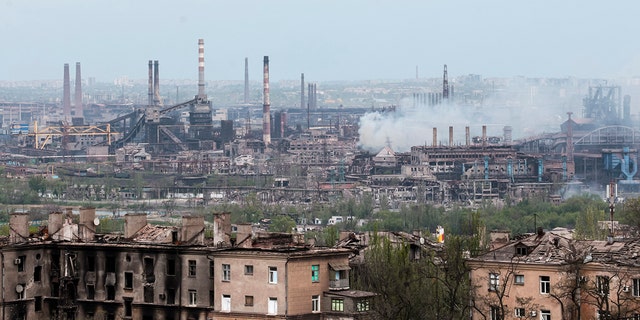 Smoke rises from the Metallurgical Combine Azovstal in Mariupol, in territory under the government of the Donetsk People's Republic, eastern in Mariupol, Ukraine, Thursday, May 5, 2022. (AP Photo)