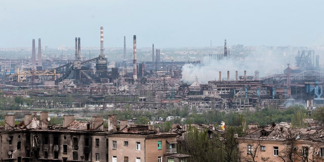 Smoke rises from the Metallurgical Combine Azovstal in Mariupol, in territory under the government of the Donetsk People's Republic, eastern in Mariupol, Ukraine, Thursday, May 5, 2022. (AP Photo)