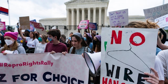 Demonstrators protest outside the U.S. Supreme Court on Thursday, May 5, 2022, in Washington. 