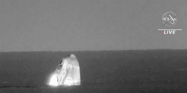 In this image made from video supplied by NASA, SpaceX Dragon space capsule splashes down in the Gulf of Mexico early Friday, May 6, 2022.