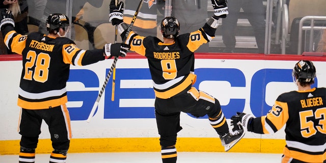 Pittsburgh Penguins' Evan Rodrigues (9) celebrates his second goal of the first period in Game 3 of an NHL hockey Stanley Cup first-round playoff series against the New York Rangers in Pittsburgh, Saturday, May 7, 2022.