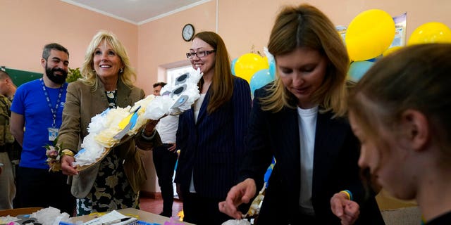 First Lady Jill Biden, second left, and Olena Zelenska, spouse of Ukrainian's President Volodymyr Zelenskyy, join a group of children at School 6 in making tissue-paper bears to give as Mother's Day gifts in Uzhhorod, Ukraine, Sunday, May 8, 2022. 