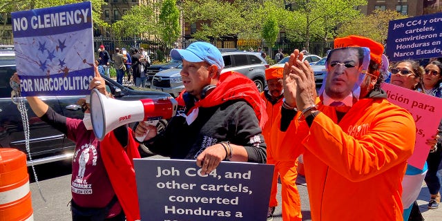 Demonstrators gather outside Manhattan federal court to protest former Honduran President Juan Orlando Hernandez, who pleaded not guilty to charges that he received millions of dollars from 2004 to 2022 to support a drug trade that delivered hundreds of thousands of kilos of drugs to the U.S., Tuesday, May 10, 2022, in New York.