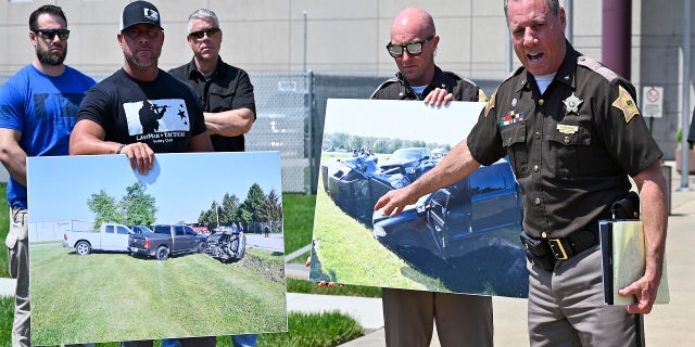 Vandenburgh County Sheriff Dave Wedding, right, refers to a photograph during a press conference in Evansville, In., Tuesday, May 10, 2022, about the capture of fugitives Casey White and Vicky White.