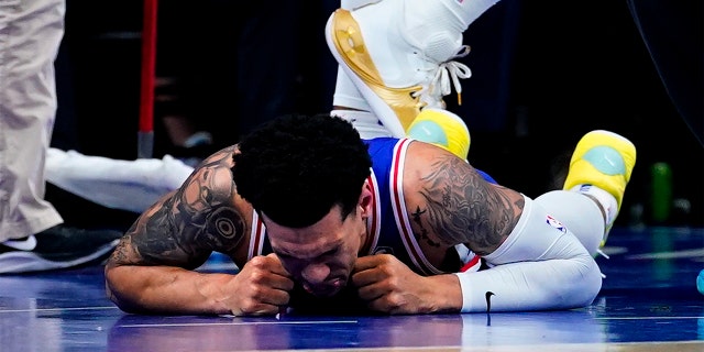 Philadelphia 76ers' Danny Green lays injured on the ground during the first half of Game 6 of an NBA basketball second-round playoff series against the Miami Heat, Thursday, May 12, 2022, in Philadelphia.