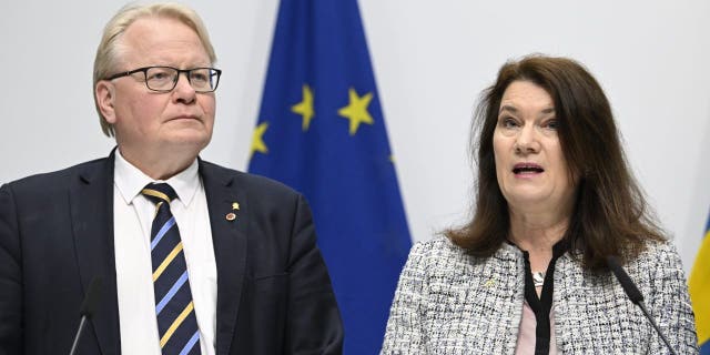 Minister of Defense Peter Hultqvist, left, and Minister of Foreign Affairs Ann Linde present a security policy analysis during a press conference in Stockholm, Sweden, Friday May 13, 2022.