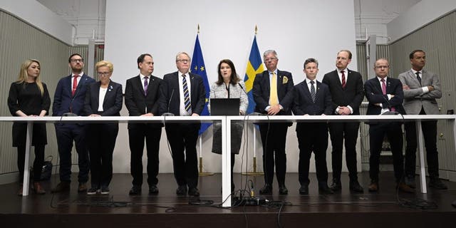 Minister of Defense Peter Hultqvist, center left, Minister of Foreign Affairs Ann Linde, center, and Sweden's security policy analysis group announce their report during a press conference in Stockholm, Sweden, Friday May 13, 2022. 