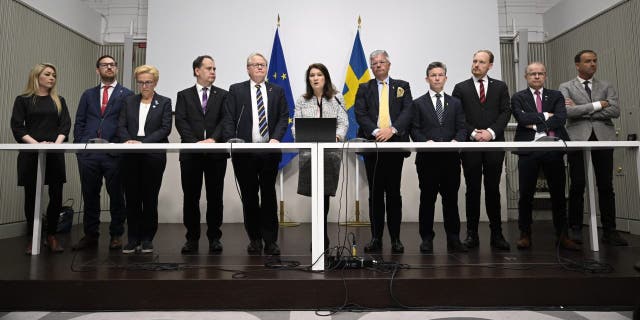 Minister of Defense Peter Hultqvist, center left, Minister of Foreign Affairs Ann Linde, center, and Sweden's security policy analysis group announce their report during a press conference in Stockholm, Sweden, Friday May 13, 2022.