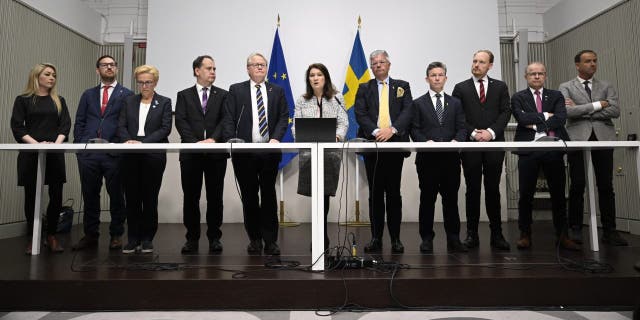 Minister of Defense Peter Hultqvist, center left, Minister of Foreign Affairs Ann Linde, center, and Sweden's security policy analysis group announce their report during a press conference in Stockholm, Sweden, Friday May 13, 2022. 