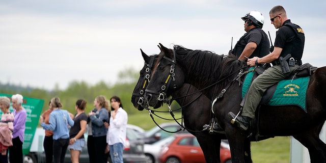 FILE -Officers on horseback guard the entrance to designated demonstrator areas near Riverbend Maximum Security Institution as people wait to enter before the scheduled execution of inmate Oscar Smith, Thursday, April 21, 2022, in Nashville, Tenn. (WHD Photo/Mark Humphrey, File)