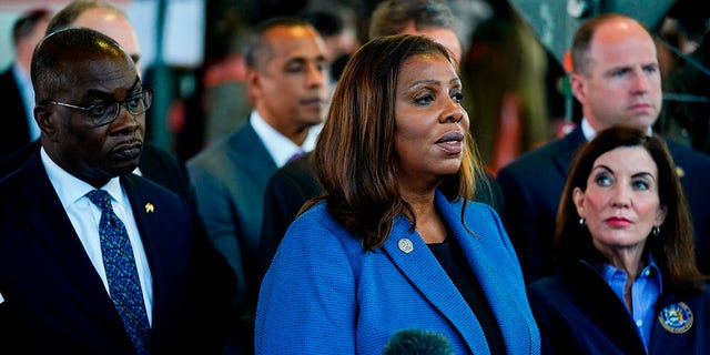 New York Attorney General Letitia James, center, accompanied by Buffalo Mayor Byron Brown, left, New York Gov. Kathy Hochul, right, and other officials, speaks with members of the media during a news conference near the scene of a shooting at a supermarket, in Buffalo, N.Y., Sunday, May 15, 2022. 