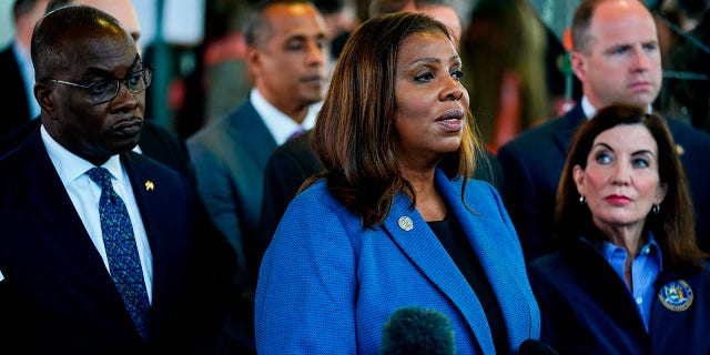 New York Attorney General Letitia James, center, flanked by Buffalo Mayor Byron Brown, New York Gov. Kathy Hochul and other officials, speaks during a news conference near the scene of a shooting at a supermarket in Buffalo, New York, on May 15, 2022.