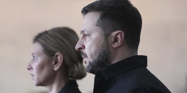 President of Ukraine Volodymyr Zelenskyy and his wife Olena Zelenska attend the funeral of Leonid Kravchuk, independent Ukraine's first president, at the International Convention Center Ukrainian House, in Kyiv, Ukraine, Tuesday, May 17, 2022. Kravchuk led Ukraine to independence amid the collapse of the Soviet Union and served as its first president. He died on May 10 at the age of 88.