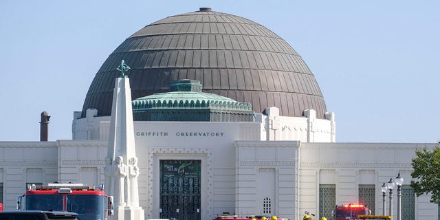 Firefighters arrive at the Griffith Observatory during a brush fire in the hills of Los Feliz in Los Angeles on Tuesday, May 17, 2022. 