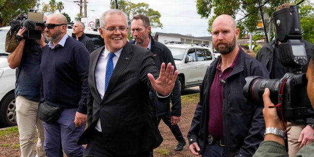 Australian Prime Minister Scott Morrison gestures after voting in his electorate of Cook in Sydney, Australia, Saturday, May 21, 2022. Australians go to the polls Saturday following a six-week election campaign that has focused on pandemic-fueled inflation, climate change and fears of a Chinese military outpost being established less than 1,200 miles off Australia's shore.