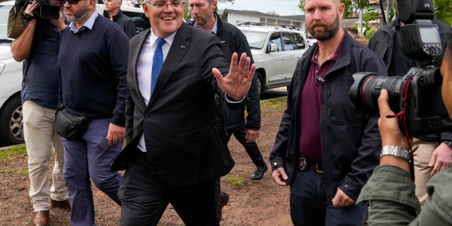 Australian Prime Minister Scott Morrison gestures after voting in his electorate of Cook in Sydney, Australia, Saturday, May 21, 2022. Australians go to the polls Saturday following a six-week election campaign that has focused on pandemic-fueled inflation, climate change and fears of a Chinese military outpost being established less than 1,200 miles off Australia's shore.