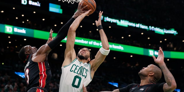 Miami Heat's Bam Adebayo blocks a shot by Celtics' Jayson Tatum during game three of the Eastern Conference finals May 21, 2022, in Boston.