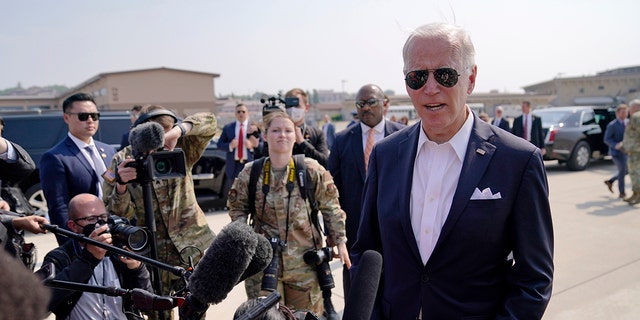President Biden speaks before boarding Air Force One for a trip to Japan at Osan Air Base, Sunday, May 22, 2022, in Pyeongtaek, South Korea.