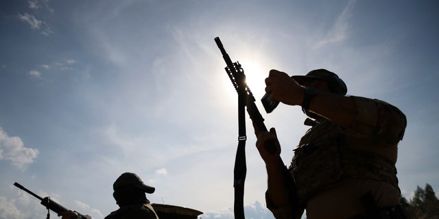 Volunteers from Belarus practice at a shooting range near Warsaw, Poland, on Friday, May 20, 2022. Belarusians are among those who have answered a call by Ukrainian President Volodymyr Zelenskyy for foreign fighters to go to Ukraine and join the International Legion for the Territorial Defense of Ukraine.