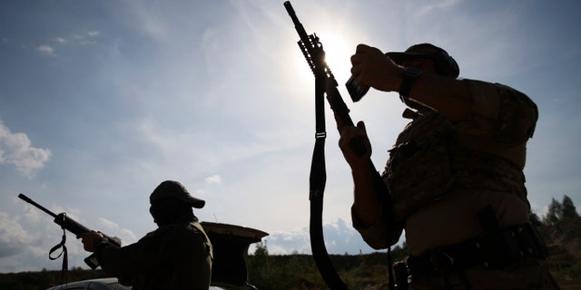 Volunteers from Belarus practice at a shooting range near Warsaw, Poland, on Friday, May 20, 2022. Belarusians are among those who have answered a call by Ukrainian President Volodymyr Zelenskyy for foreign fighters to go to Ukraine and join the International Legion for the Territorial Defense of Ukraine.