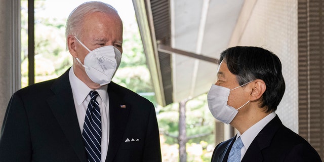 Japan's Emperor Naruhito, right, greets U.S. President Joe Biden prior to their meeting at the Imperial Palace in Tokyo Monday, May 23, 2022.