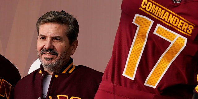 FILE - Dan Snyder, co-owner and co-CEO of the Washington Commanders, poses for photos during an event to unveil the NFL football team's new identity, Wednesday, Feb. 2, 2022, in Landover, Md.