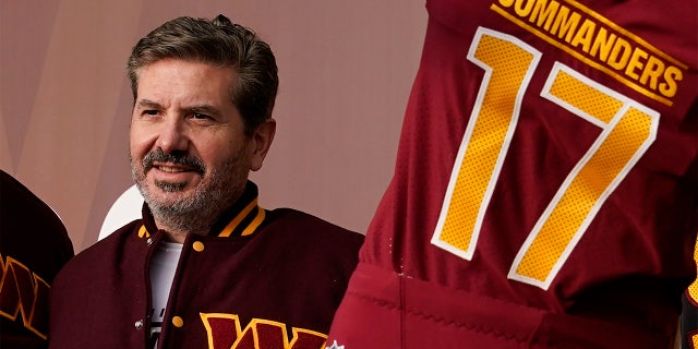 FILE - Dan Snyder, co-owner and co-CEO of the Washington Commanders, poses for photos during an event to unveil the NFL football team's new identity, Wednesday, Feb. 2, 2022, in Landover, Md.