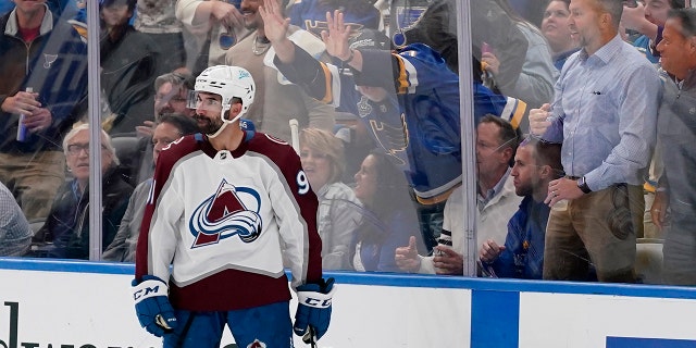 Fans react after a goal by Colorado Avalanche's Nazem Kadri during the second period in Game 4 of an NHL hockey Stanley Cup second-round playoff series against the St. Louis Blues. 