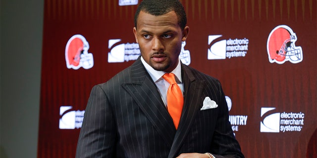 Cleveland Browns new quarterback Deshaun Watson enters a news conference at the NFL football team's training facility, on March 25, 2022, in Berea, Ohio. 