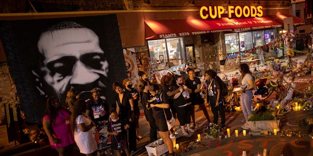 FILE - Dante Wright's family gathers for the first anniversary of George Floyd's death on May 25, 2021 in Minneapolis. A candlelight vigil to honor Floyd's memory at the intersection where he died was one of the remembrances scheduled for Wednesday's second anniversary of the killing of a black man at the hands of Minneapolis police officers.