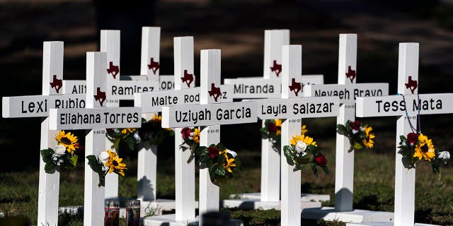 Crosses with the names of Tuesday's shooting victims are placed outside Robb Elementary School in Uvalde, Texas, Thursday, May 26, 2022. The 18-year-old man who slaughtered 19 children and two teachers in Texas left a digital trail that hinted at what what to come  (AP Photo/Jae C Hong)