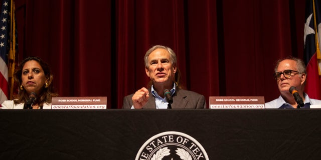 Texas Gov. Greg Abbott, center, during a news conference about the elementary school shooting with Uvalde Mayor Don McLaughlin, North and Texas District Attorney in the 38th Judicial District, Christina Mitchell Busbee, Friday, May 27, 2022, in Uvalde , Texas. (AP Photo/Dario Lopez-Mills)
