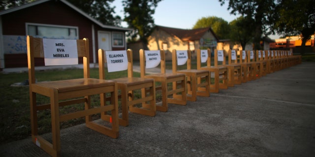 Twenty-one empty chairs are seen outside of a daycare center as a memorial for the victims killed earlier in the week in the elementary school shooting in Uvalde, Texas, Friday, May 27, 2022.