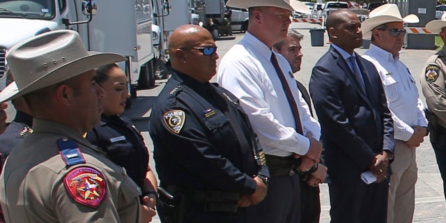 Uvalde School Police Chief Pete Arredondo, third from left, stands during a news conference outside of the Robb Elementary school in Uvalde, Texas Thursday, May 26, 2022. 