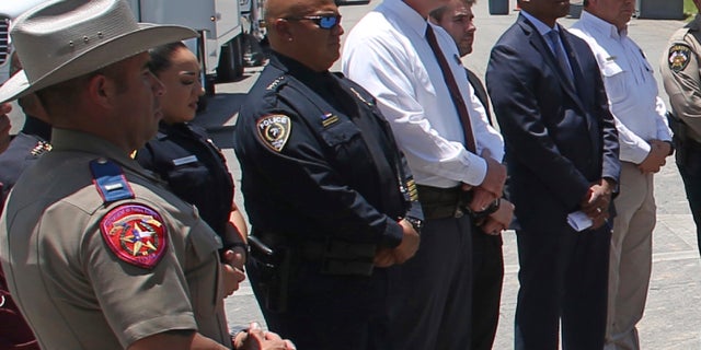 Uvalde School Police Chief Pete Arredondo, third from left, stands during a news conference outside of the Robb Elementary school in Uvalde, Texas Thursday, May 26, 2022.