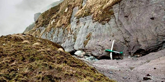 This handout photograph released by Fishtail Air, shows the wreckage of a plane in a gorge in Sanosware in Mustang district close to the mountain town of Jomsom, west of Kathmandu, Nepal, Monday, May 30, 2022. The wreckage of a plane carrying 22 people that disappeared in Nepal's mountains was found Monday scattered on a mountainside, the army said. There was no word on survivors. (Fishtail Air via G3 Box News)