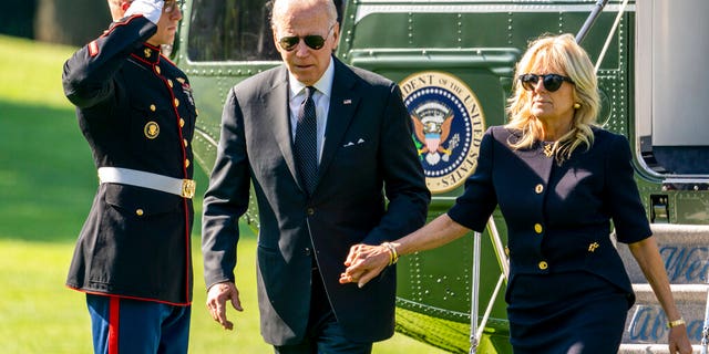 President Joe Biden and first lady Jill Biden arrive on the South Lawn of the White House, May 30, 2022. (AP Photo/Andrew Harnik)