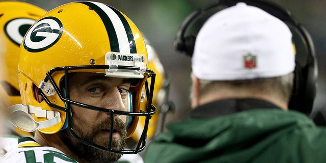 Aaron Rodgers and head coach Mike McCarthy of the Green Bay Packers talk during the Seahawks game at CenturyLink Field on Nov. 15, 2018, in Seattle.