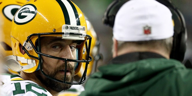 Aaron Rodgers and head coach Mike McCarthy of the Green Bay Packers talk during the Seahawks game at CenturyLink Field on Nov. 15, 2018, in Seattle.