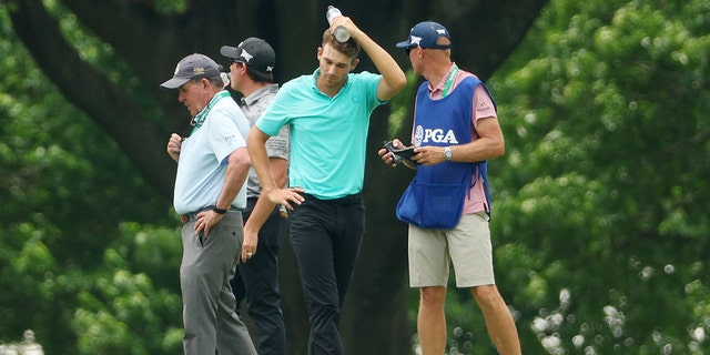 Aaron Wise of the U.S. stands on the seventh hole after being hit by a ball hit by Cameron Smith of Australia during the second round of the 2022 PGA Championship at Southern Hills Country Club May 20, 2022, in Tulsa, Okla.