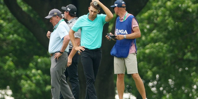 Aaron Wise of the U.S. stands on the seventh hole after being hit by a ball hit by Cameron Smith of Australia during the second round of the 2022 PGA Championship at Southern Hills Country Club May 20, 2022, in Tulsa, Okla.