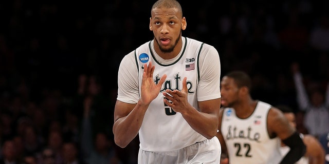 Adreian Payne of the Michigan State Spartans reacts after a basket against the Connecticut Huskies during the NCAA Men's Basketball Tournament at Madison Square Garden on March 30, 2014, in New York City.