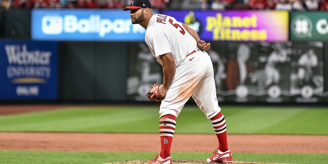 St. Louis Cardinals designated hitter Albert Pujols (5) throws a pitch in the top of the ninth with his team up 15-2 during a game between the San Francisco Giants and the St. Louis Cardinals on May 15, 2022, at Busch Stadium in St. Louis MO.