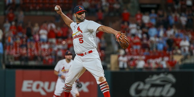  Albert Pujols #5 of the St. Louis Cardinals pitches during the ninth inning against the San Francisco Giants at Busch Stadium on May 15, 2022 a St. Louis, Missouri.