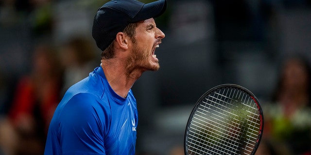 Andy Murray, of Britain, celebrates a point against Dominic Thiem of Austria during their match at the Mutua Madrid Open tennis tournament in Madrid, Spain, Monday, May 2, 2022. 